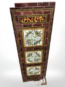 A Victorian tiled panel from a fire surround, 97 cm x 31 cm.