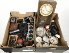 A group of quartz timepieces, thermometer, wall clock, Nikon and other cameras, microphone,