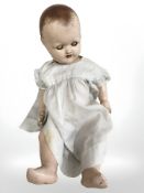 A vintage jointed doll.