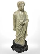 A Chinese carved soapstone figure of Buddha, height 35 cm.
