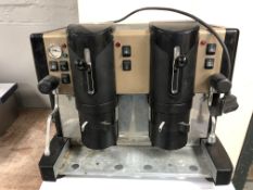 A Spinel commercial counter top coffee machine.