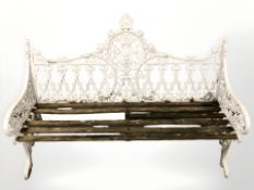 A late Victorian painted cast iron and teak garden bench,