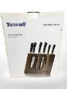 A Ticwell seven piece knife set, boxed.