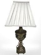 A brass table lamp in the form of a classical urn,