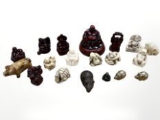 A group of oriental resin, brass and pottery figures,