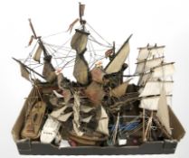 A group of wooden model ships.
