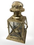 A brass hanging oil lantern, height 30 cm including handle.