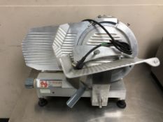 A Newscan stainless steel commercial slicer.