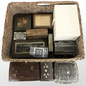 A wicker basket containing assorted trinket and jewellery boxes.