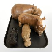 Two carved hardwood hippopotamus figures, further rhino and a resin figure of Buddha.