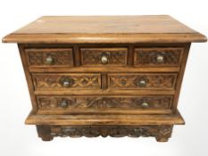 An Eastern carved hardwood jewellery box, width 44 cm.