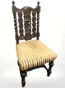 A 19th century heavily carved oak hall chair