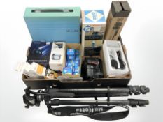 A Sony handycam video camera, camera tripod, lightbulbs, Nikon camera, gas camping stove, etc.