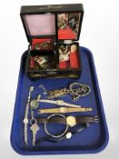 An Oriental lacquered jewellery box containing assorted costume jewellery, lady's wristwatches, etc.