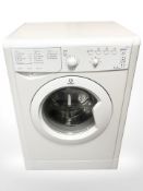 An Indesit 7kg washing machine.