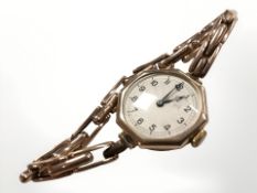 A lady's vintage 9ct gold octagonal-cased wristwatch on 9ct gold expanding strap.
