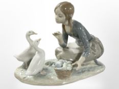A Lladro figure group of a girl with geese, No. 5553, boxed.