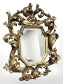 A 20th century gilt plaster mirror in the Florentine style 75 cm x 59 cm