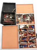 Three wooden boxes containing assorted Meccano.