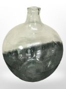 A large glass carboy,