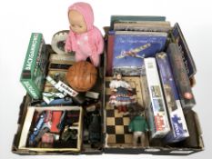 A group of puzzles, chessboard, die cast cars, dolls, several volumes.