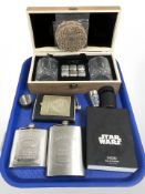 A cased pair of whisky glasses, two modern Jack Daniels hip flasks,