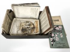A box containing a quantity of vintage sheet music.