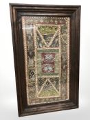 An Indian heavily embroidered and sequined panel in hardwood frame, 98 cm x 59 cm.