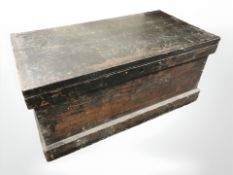 A 19th century joiner's tool box containing wood working planes, brushes,