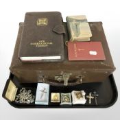 A group of religious articles including crucifixes, pendants, rosary beads, pocket bible.