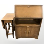An oak fall front bureau, width 76 cm, and an oak gate leg table.