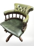 A Chesterfield style leather swivel captain's desk chair,