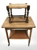 A teak two tier trolley, width 61 cm, and an oak and rush seated stool.