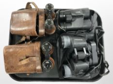 A pair of Bushnell 8x42 binoculars, Viking 8x42 binoculars and two pairs of antique field glasses,