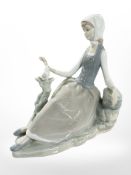 A Lladro figure of a lady with dove, height 17 cm.