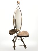 An unusual wrought metal and rustic burr wood double sided dressing table mirror raised on trolley
