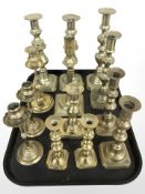 Four pairs of Victorian brass candlesticks and another five singles.