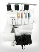 A Brother Lock 1034D overlocker sewing machine, with lead and pedal.