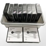 Ten boxed massage guns.