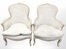 A pair of reproduction French style carved armchairs,