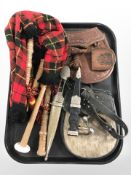 A small set of bagpipes, a Scottish Skean Dhu plus another knife and two sporrans.