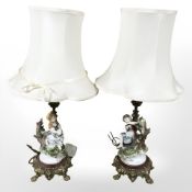 A pair of 20th century Bavarian porcelain figural lamp bases on decorative gilt brass stands,