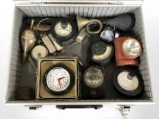 An aluminium case containing various vintage gauges, milliamp meter, volt meter,