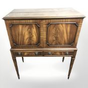 A reproduction mahogany drinks cabinet,