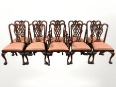 A reproduction set of ten stained and carved hardwood Chippendale style dining chairs comprising
