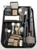 A group of gents quartz wristwatches, lighters, folding rule, two telescopic sights,