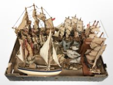 A collection of wooden model ships and a pair of ship book ends.