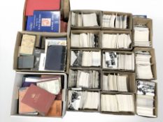 A vast quantity of modern monochrome postcards, stamp albums and philatelic materials.