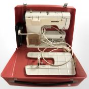 A Bernina electric sewing machine, with lead and pedal, in carry case.