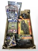 A group of figurines including Gundam, Dark Angel, Sakura from Street Fighter,